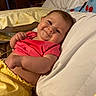 baby, child, infant, smiling, happy, portrait, bed, bedroom, pillow, blanket, pink_clothing, yellow_blanket, lying_down, indoor, cozy, bedding, twinkle_lights, face, arms, family_photo