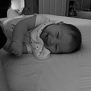 Athena joined the competition — help win amazing prizes! baby, infant, sleeping, bed, bedroom, blanket, onesie, portrait, face, closed_eyes, curled_up, lying_down, indoors, home, furniture, bedding, monochrome, black_and_white, peaceful, child