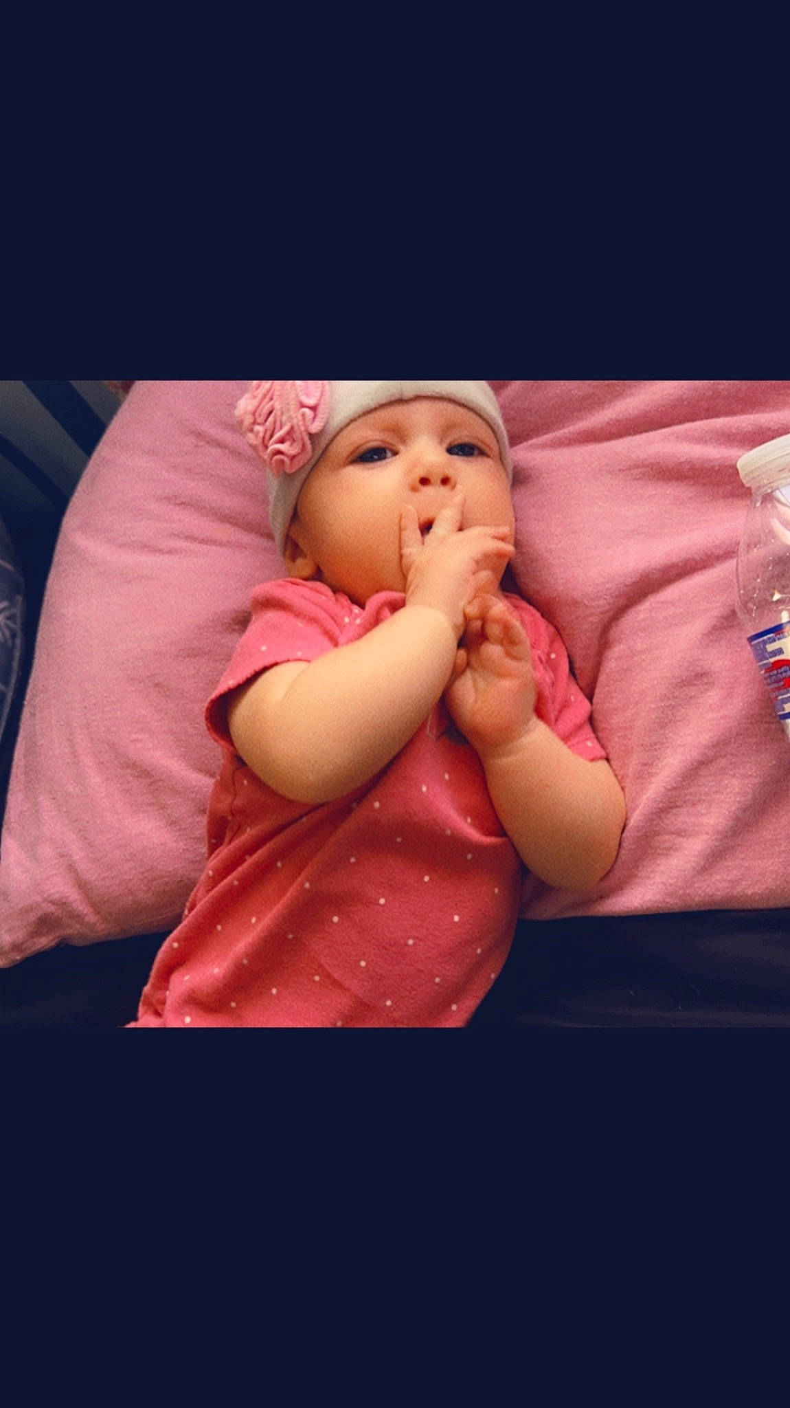 Ocean Ivory Riley is registered to the contest to win money with this photo: baby, baby_sleeping, baby_toddler_clothing, cheek, child, comfort, elbow, flash_photography, gesture, hand, happy, headwear, human_body, lip, magenta, mouth, nose, person, pink, sitting