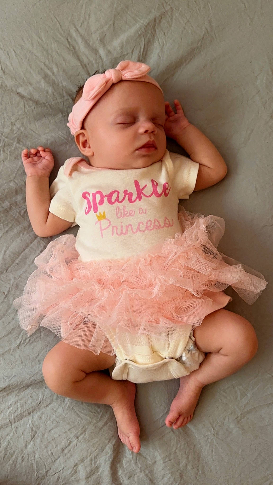 Mayson joined the competition — help win amazing prizes! arm, baby, baby_toddler_clothing, comfort, day_dress, dress, embellishment, face, fashion_accessory, happy, human_leg, pattern, peach, person, pink, ruffle, sitting, skin, sleeve, thigh