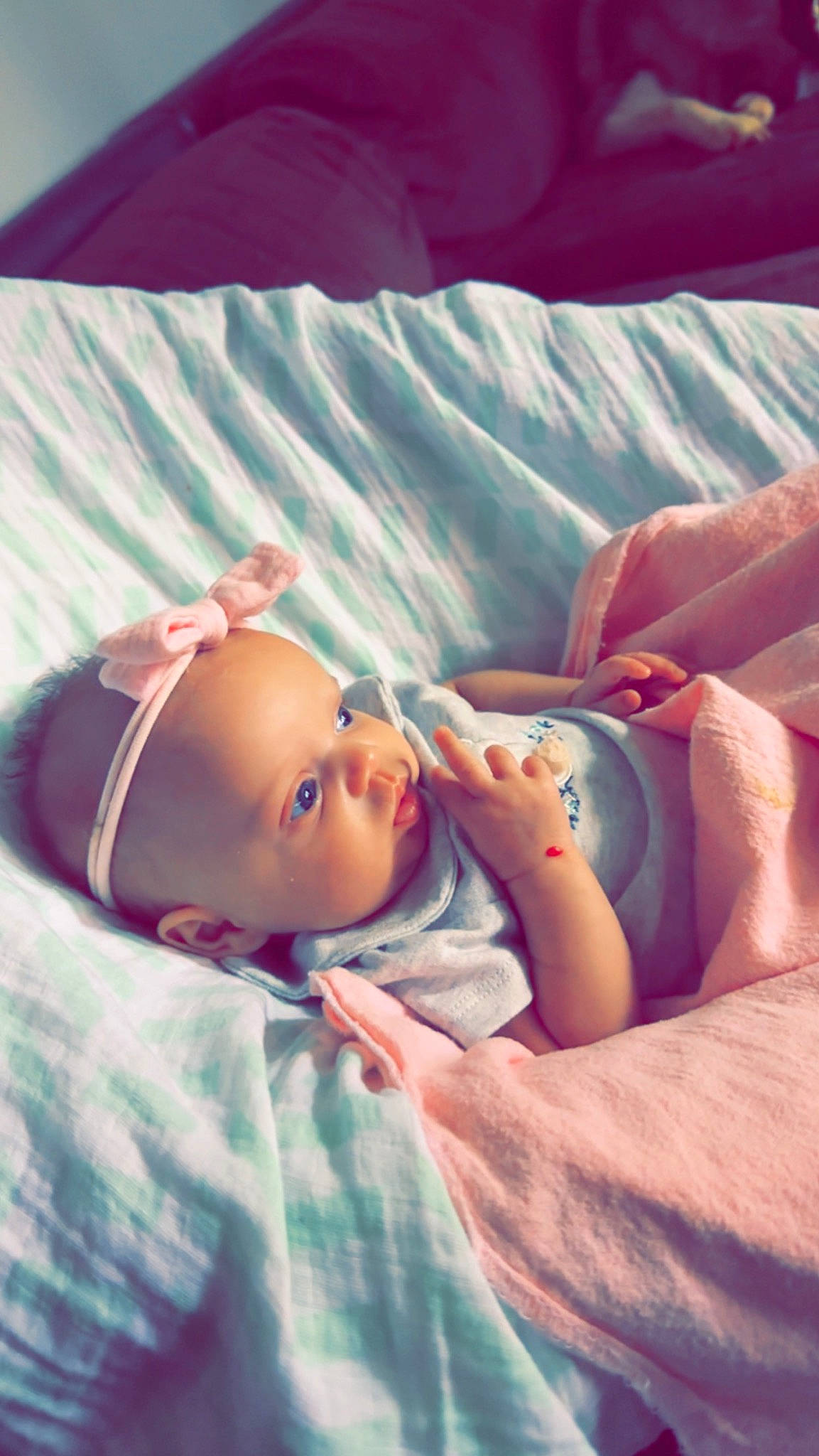 Mayson is registered to the contest to win money with this photo: bedding, blond, brown_hair, child, comfort, doll, eyelash, eyewear, fashion_accessory, flesh, grass, happy, headgear, human_leg, linens, lip, nap, person, room, sitting
