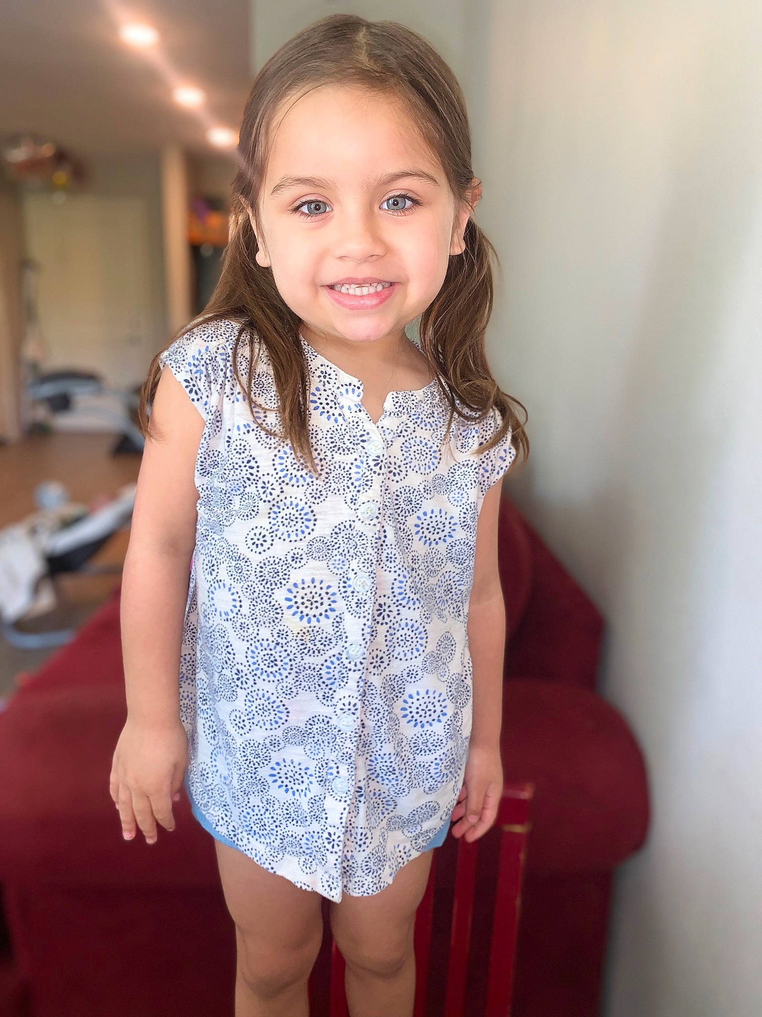 Addilyn is registered to the contest to win money with this photo: dress, embellishment, face, facial_expression, fashion_design, flooring, hair, hairstyle, happy, head, iris, joy, neck, one_piece_garment, person, shoulder, skin, sleeve, smile, standing