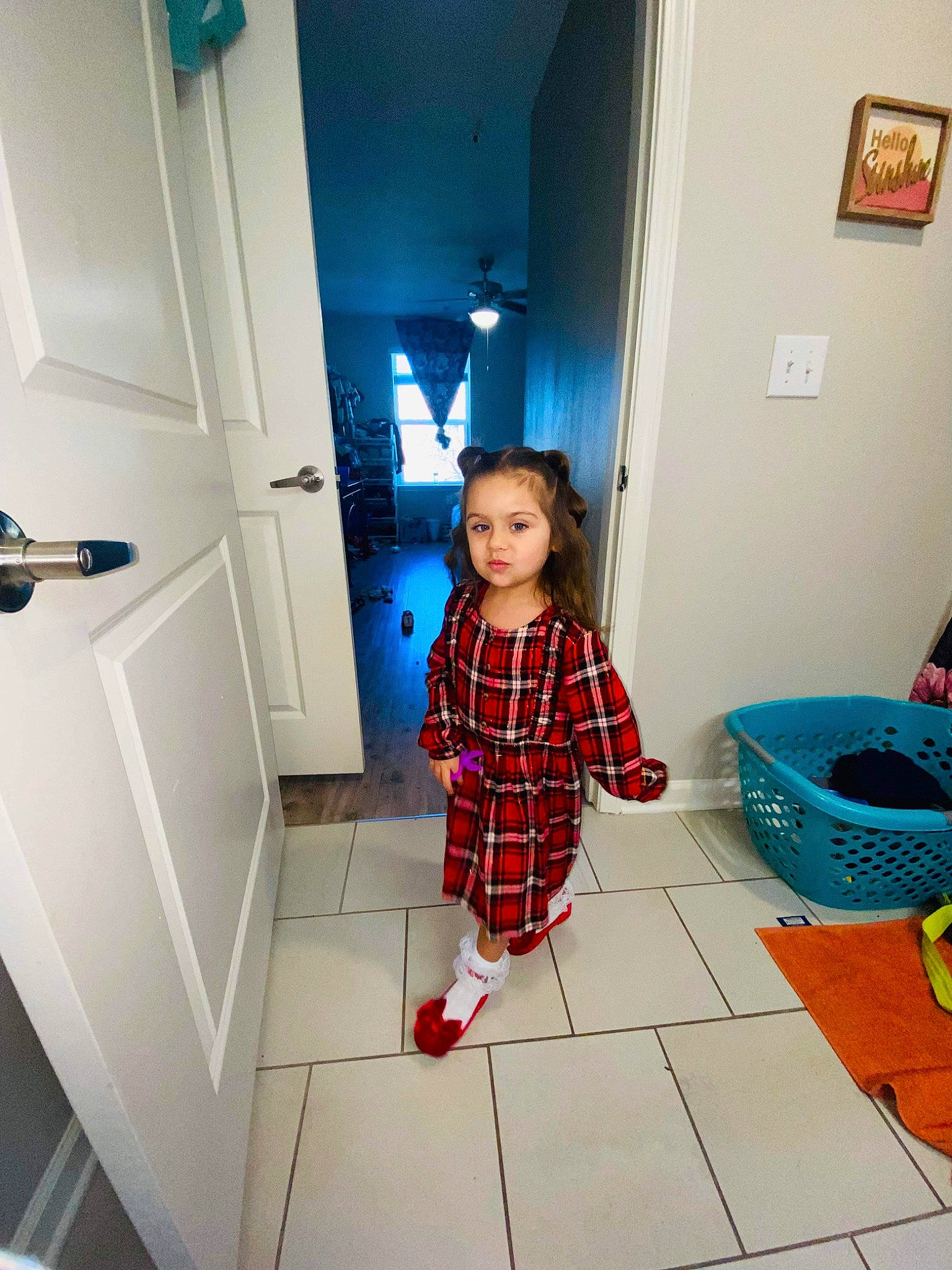 Addilyn is registered to the contest to win money with this photo: baby, baby_toddler_clothing, blue, child, door, floor, flooring, fun, handle, hardwood, interior_design, pattern, person, picture_frame, plaid, property, purple, sleeve, tartan, toddler