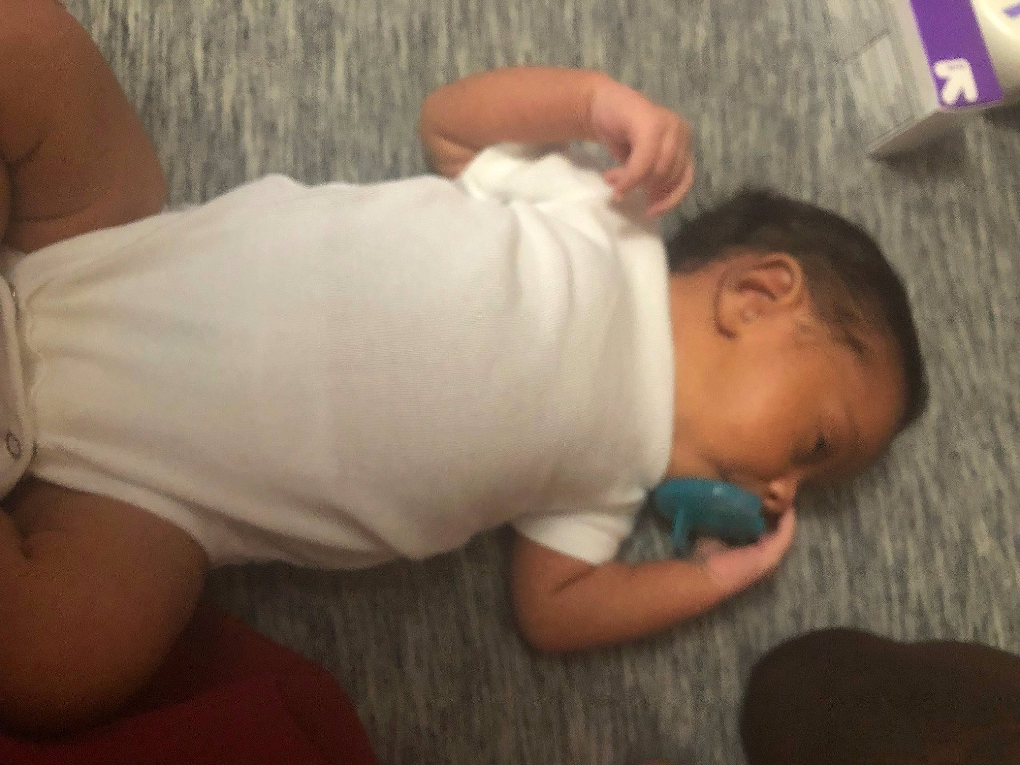 Lynette is registered to the contest to win money with this photo: baby, baby_toddler_clothing, cheek, child, comfort, elbow, finger, flooring, foot, gesture, human_leg, linens, nail, nose, person, skin, sleeve, textile, thumb, toddler