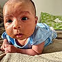 Ilyana participe au concours pour gagner de l'argent avec cette photo : baby, infant, blue_clothing, blanket, face, eyes, skin, head, hand, lying_down, indoors, pillow, soft_texture, cute, child, person, portrait, young, expression, curious
