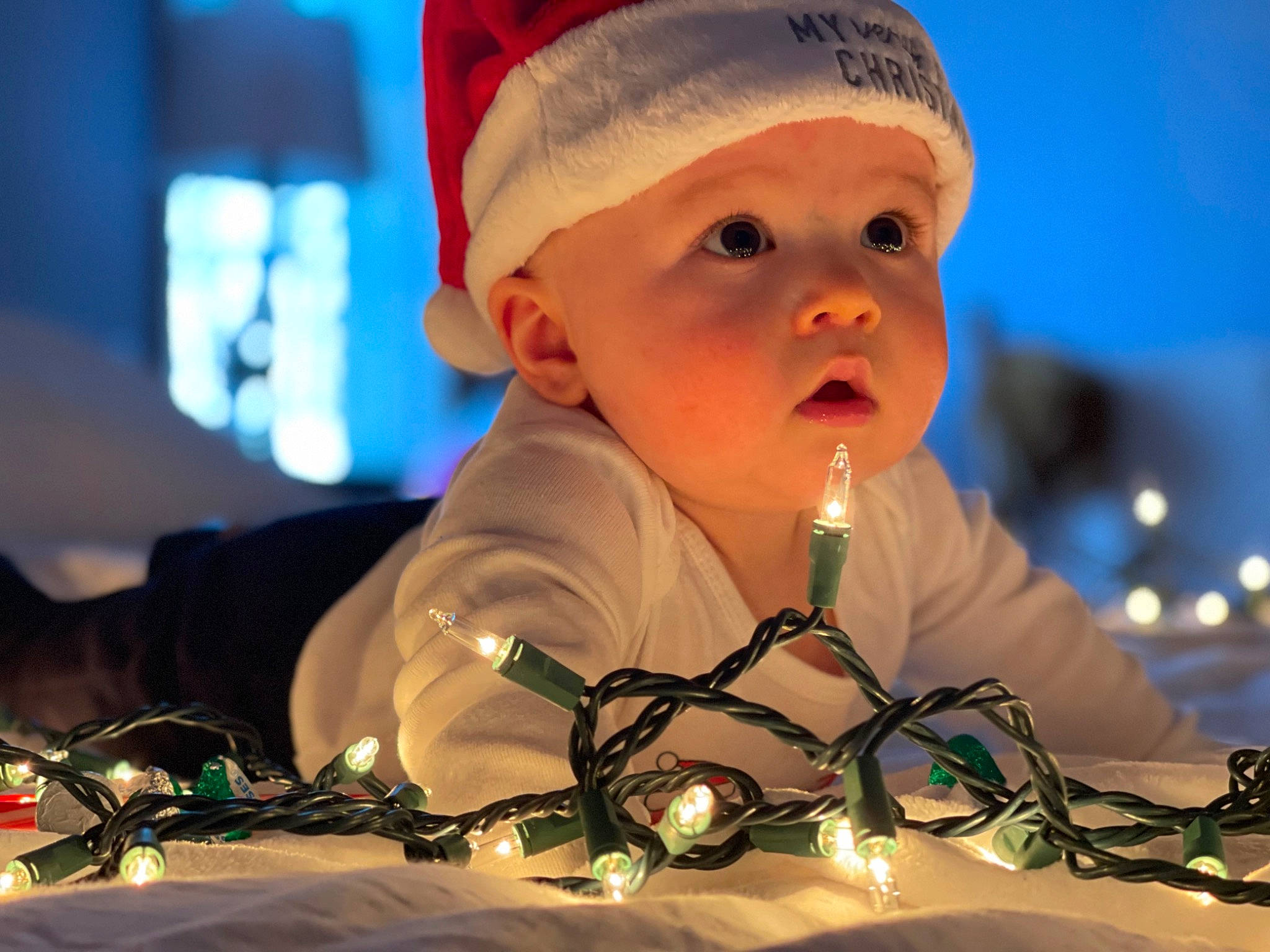 Paxton joined the competition — help win amazing prizes! audio_equipment, baby, beanie, cap, child, christmas, darkness, entertainment, event, fun, glass, happy, headwear, holiday, leisure, light, lighting, person, photograph, sky