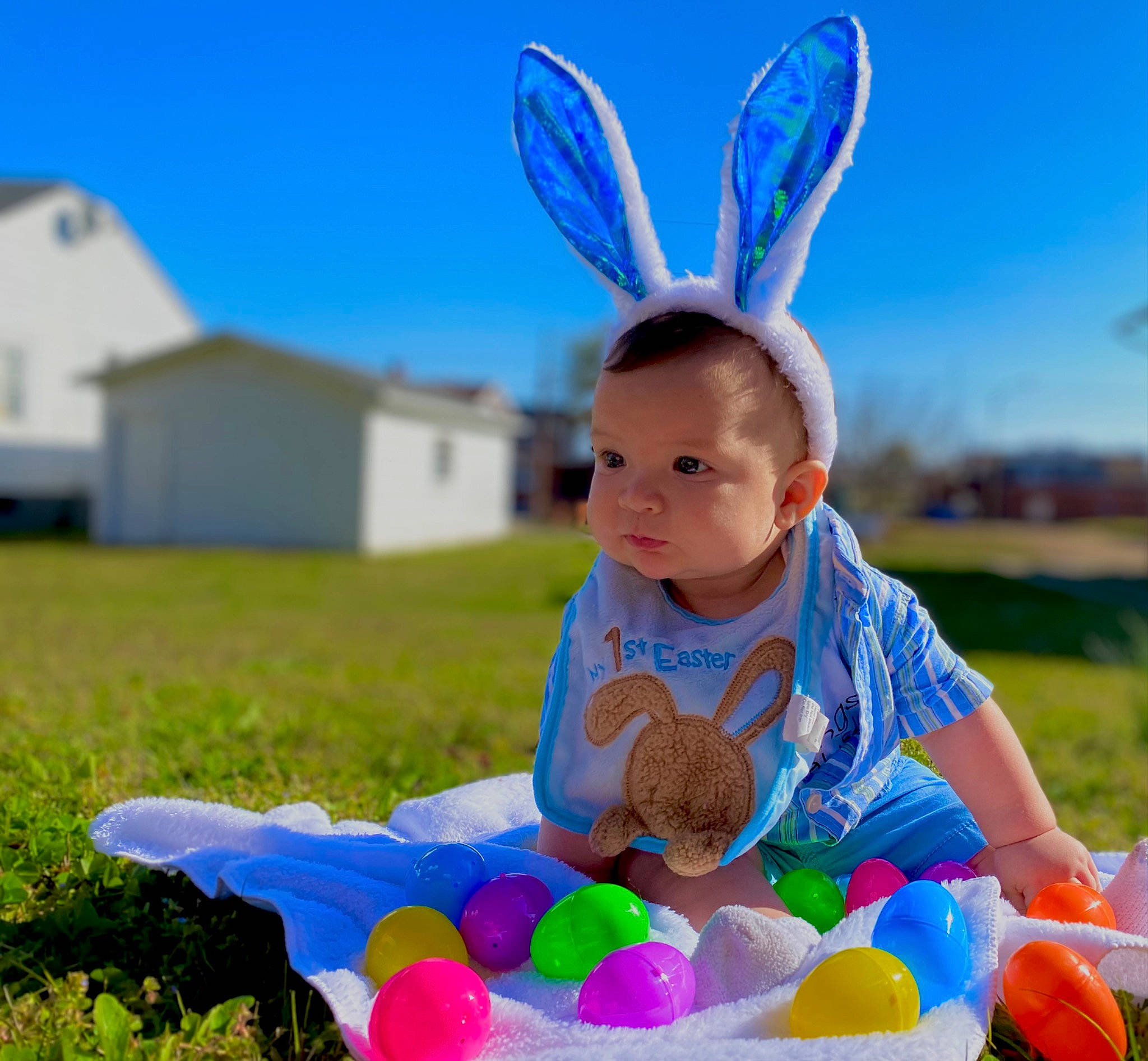 Nehemiah is registered to the contest to win money with this photo: baby, baby_toddler_clothing, blue, child, easter, event, fun, grass, grassland, green, happy, leisure, light, people, people_in_nature, person, photograph, plant, recreation, sky