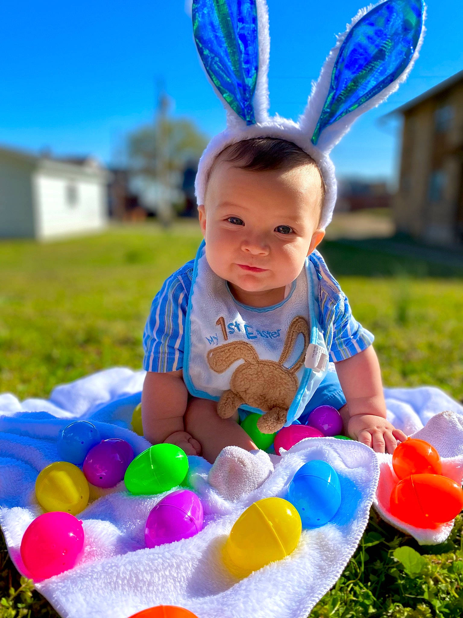 Nehemiah is registered to the contest to win money with this photo: baby_toddler_clothing, blue, child, face, facial_expression, fun, grass, green, happy, light, party_supply, people, person, photograph, pink, product, sky, summer, toddler, white