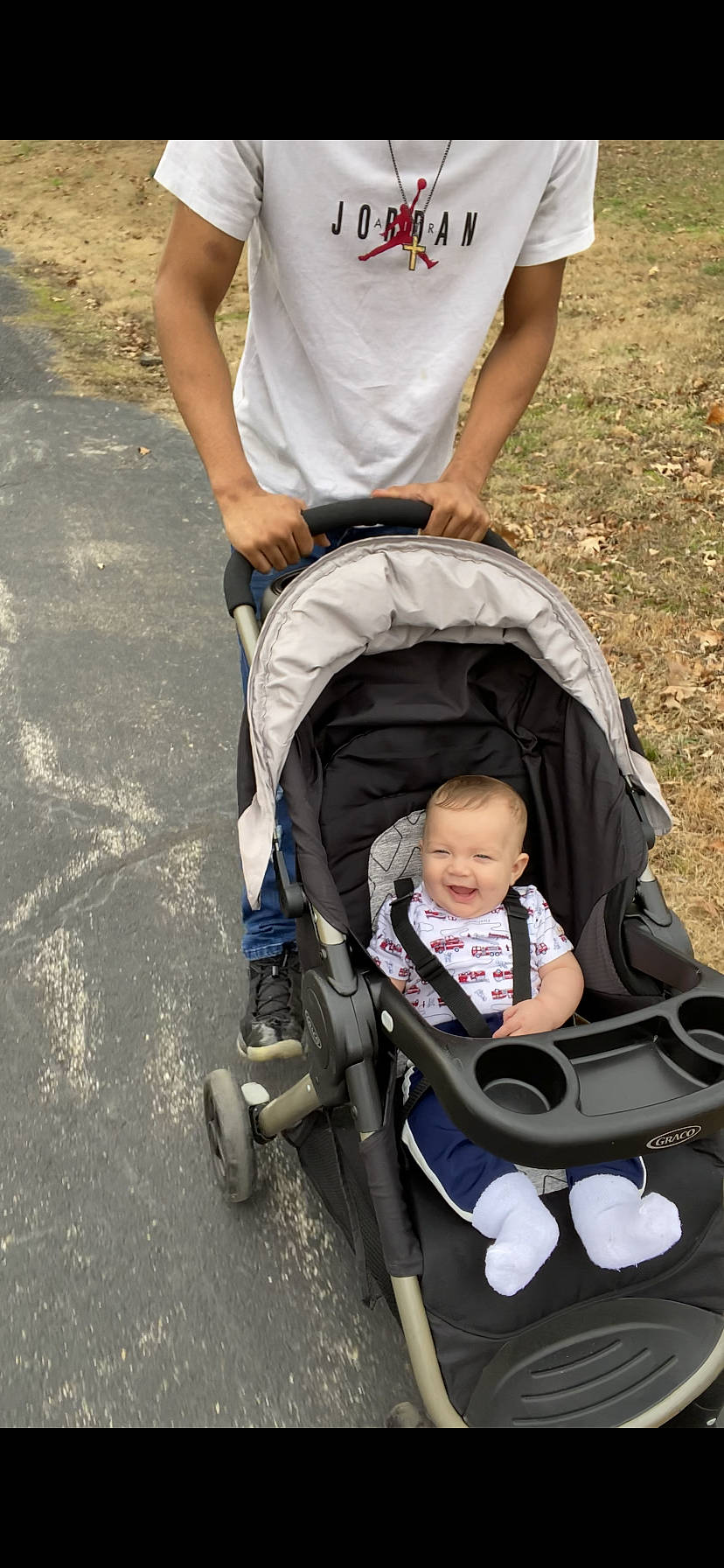Nehemiah joined the competition — help win amazing prizes! arm, baby, baby_carriage, baby_products, baby_safety, child, comfort, fun, grass, joy, lap, leisure, people_in_nature, person, plant, recreation, shorts, sitting, tire, toddler