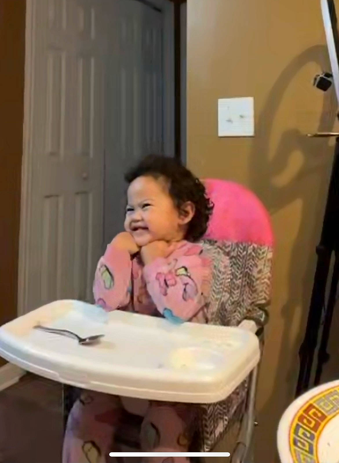 Esme is registered to the contest to win money with this photo: child, comfort, door, event, fun, happy, joy, party, person, plate, room, sitting, smile, t_shirt, table, tableware, toddler