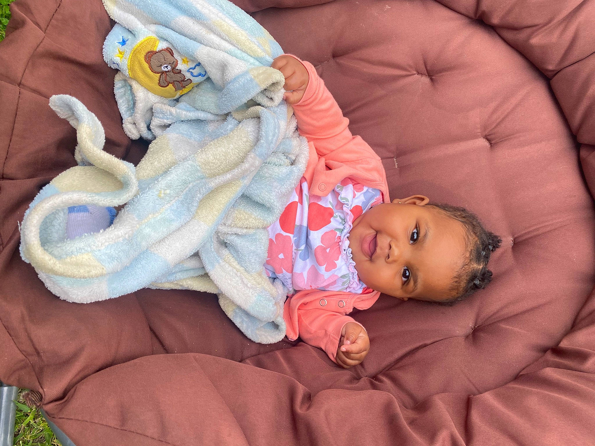 Layla joined the competition — help win amazing prizes! baby, baby_products, baby_sleeping, baby_toddler_clothing, bedtime, cheek, child, comfort, couch, finger, head, lap, leg, linens, orange, person, room, sitting, skin, toddler