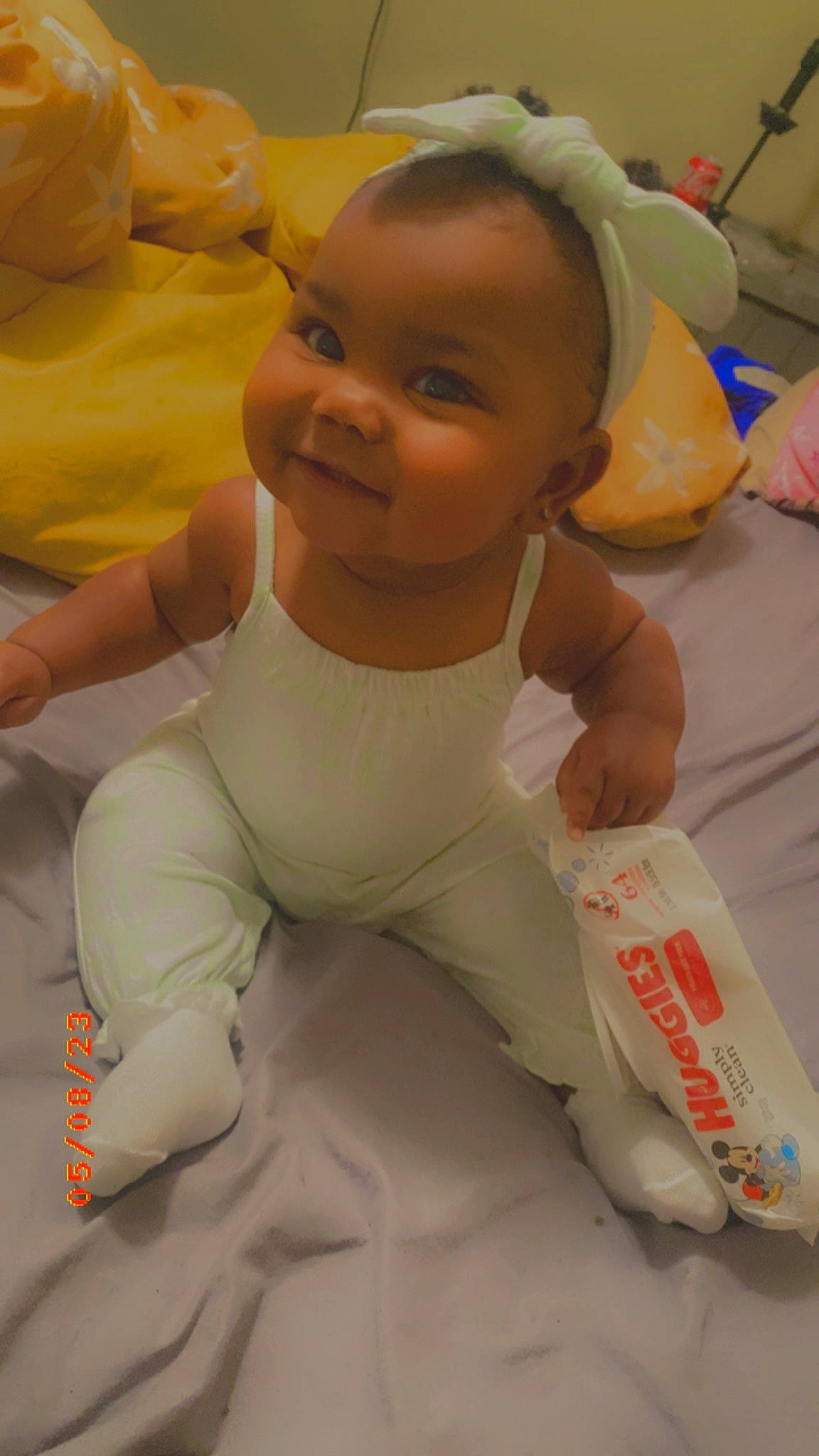 Layla joined the competition — help win amazing prizes! baby, baby_toddler_clothing, cheek, chest, child, comfort, face, flooring, foot, fun, happy, head, human_leg, person, plastic_bag, sitting, skin, sleeve, smile, thumb