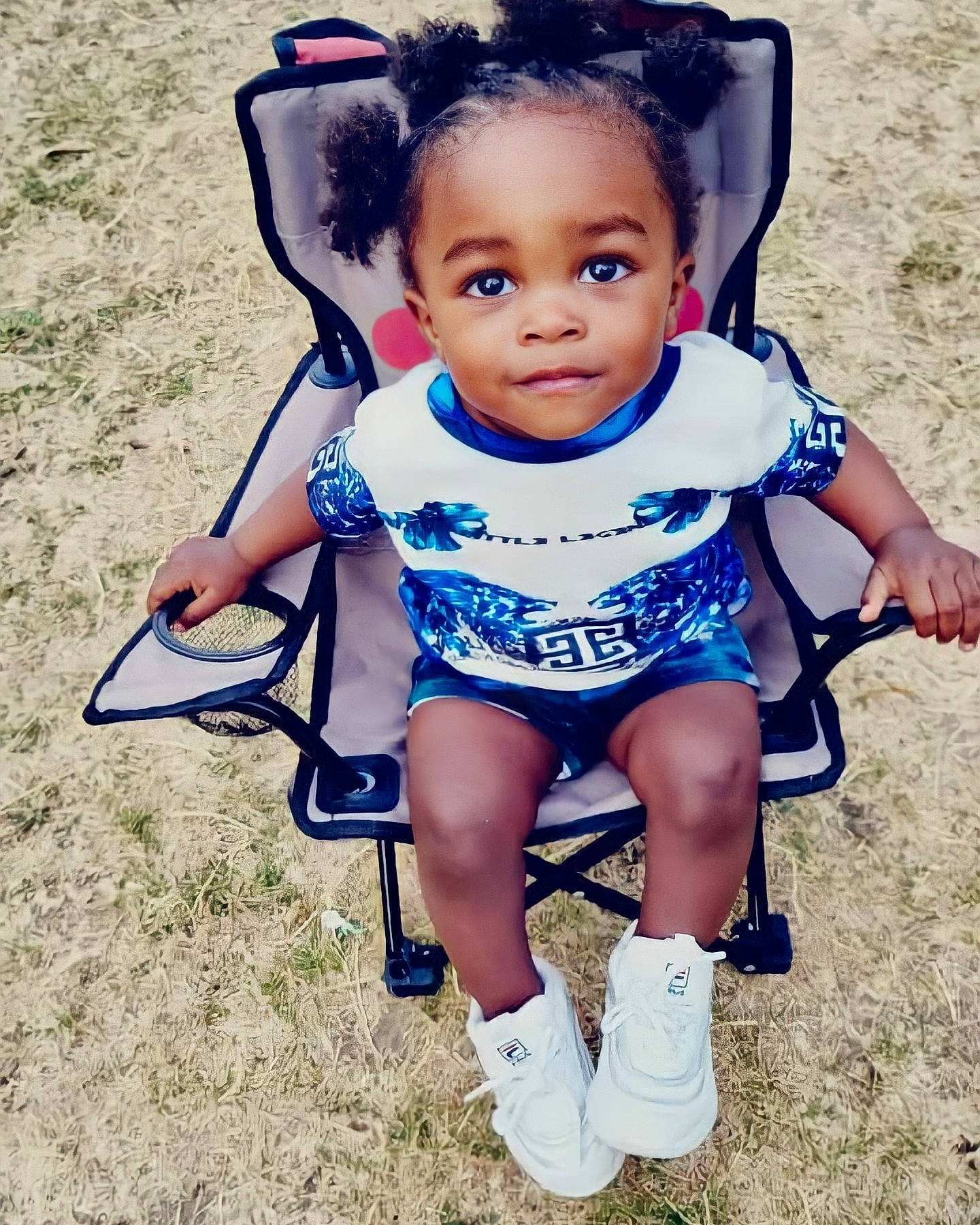 Saleem joined the competition — help win amazing prizes! azure, baby, baby_products, baby_toddler_clothing, chair, chin, electric_blue, eye, face, fun, grass, hair, happy, head, human_leg, person, sitting, smile, sneakers, thigh