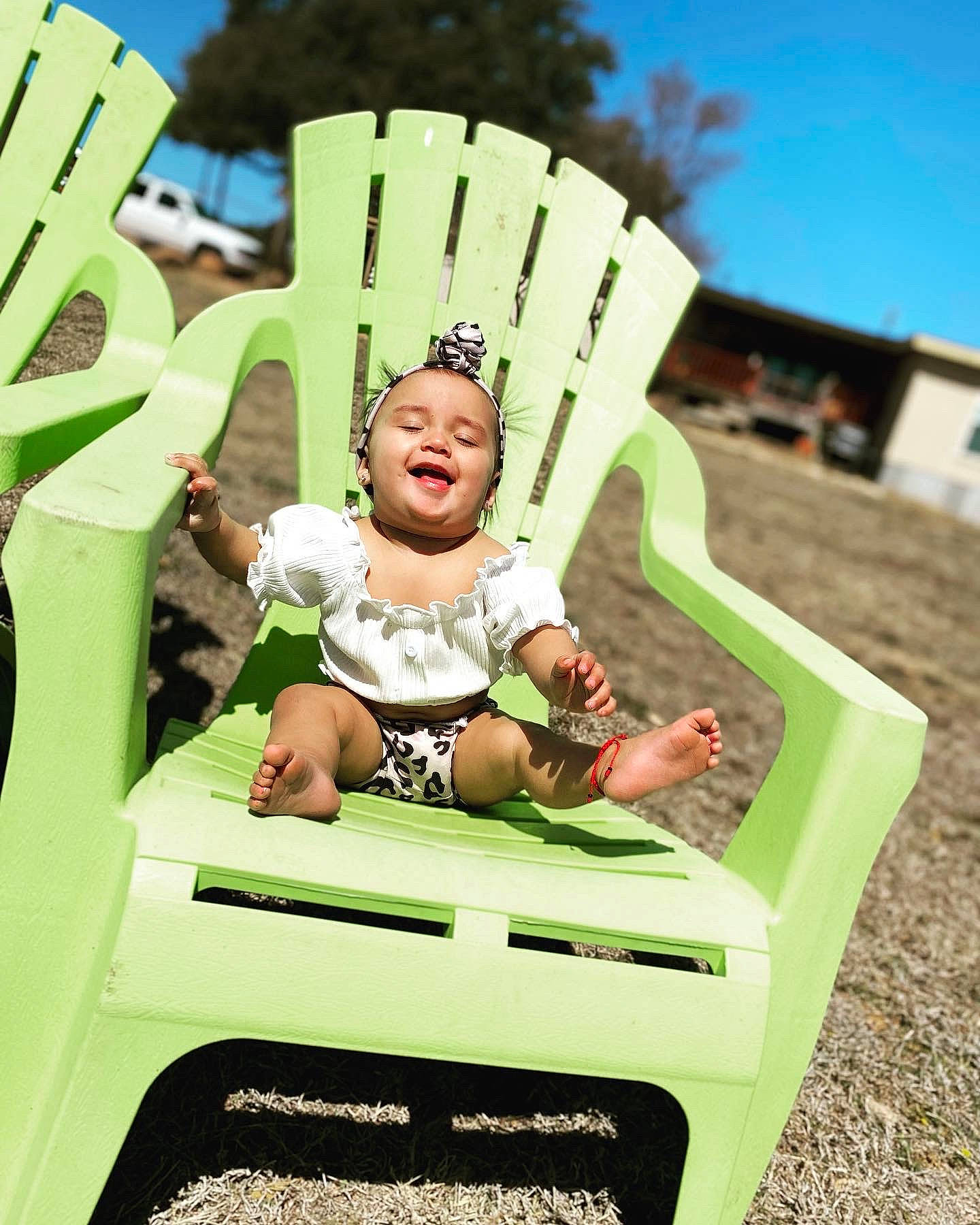 Evelyn joined the competition — help win amazing prizes! automotive_exterior, baby, bumper, chair, child, crown, fashion_accessory, fun, grass, happy, leisure, motor_vehicle, outdoor_play_equipment, person, personal_protective_equipment, recreation, sitting, sky, smile, toddler