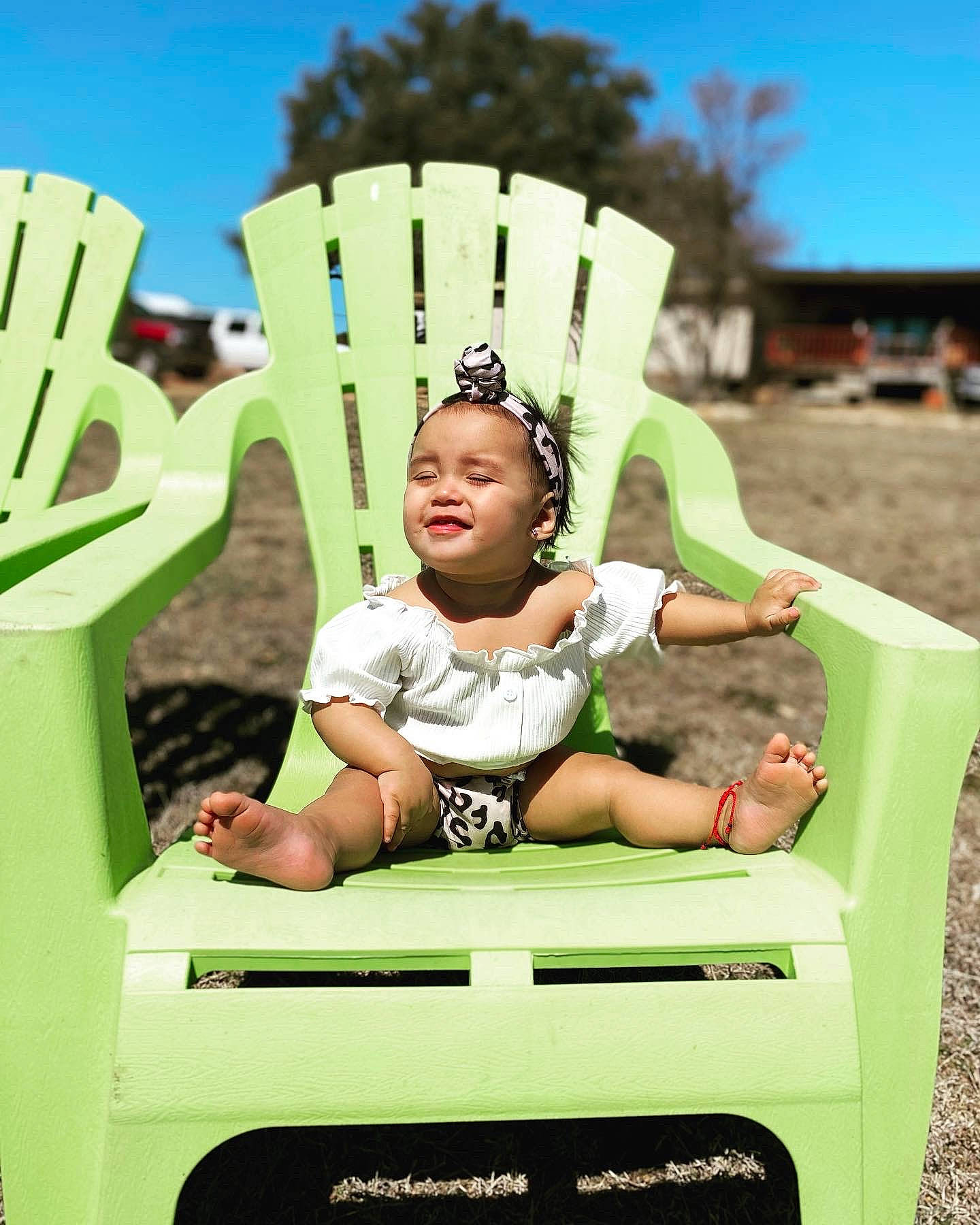 Evelyn joined the competition — help win amazing prizes! box, child, city, fun, grass, green, happy, jewellery, laugh, leisure, outdoor_play_equipment, person, personal_protective_equipment, play, recreation, sitting, sky, smile, t_shirt, toddler