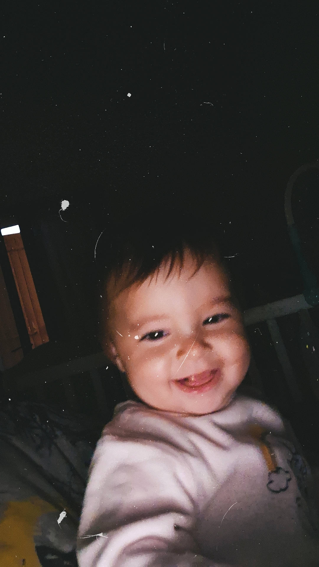 Léonie participe au concours pour gagner de l'argent avec cette photo : astronomical_object, baby, cheek, child, darkness, eyebrow, flash_photography, fun, happy, human_body, iris, joy, midnight, night, nose, person, smile, space, tints_and_shades, toddler