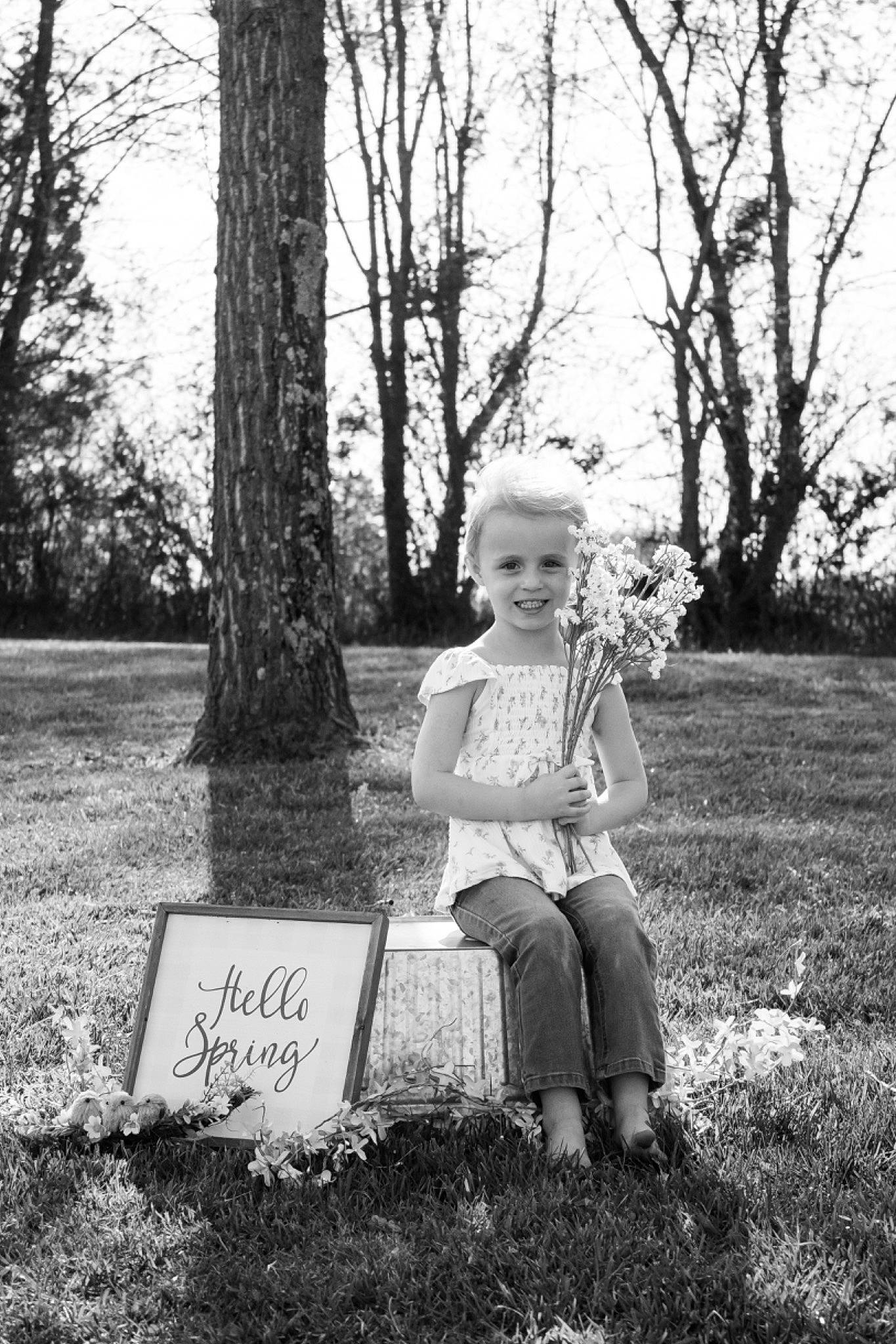 Avery Alizabeth is registered to the contest to win money with this photo: bench, black_and_white, child, forest, grass, handwriting, happy, joy, monochrome, monochrome_photography, people_in_nature, person, plant, portrait_photography, sitting, sky, stock_photography, style, tints_and_shades, toddler
