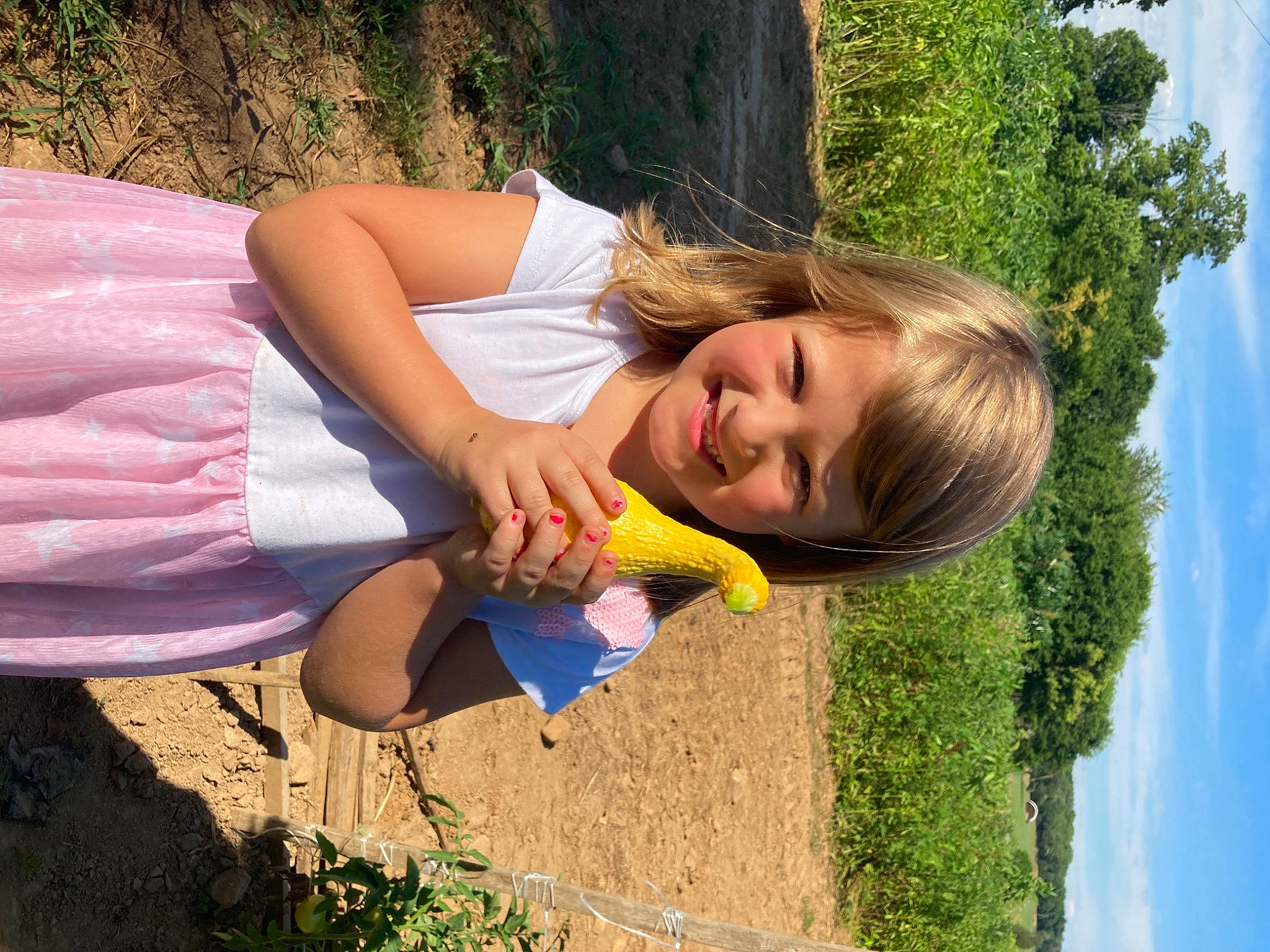 Gabrielle is registered to the contest to win money with this photo: botany, cloud, electric_blue, fun, grass, grass_family, happy, human_leg, joy, landscape, leisure, people_in_nature, person, plant, recreation, sky, smile, soil, summer, tree