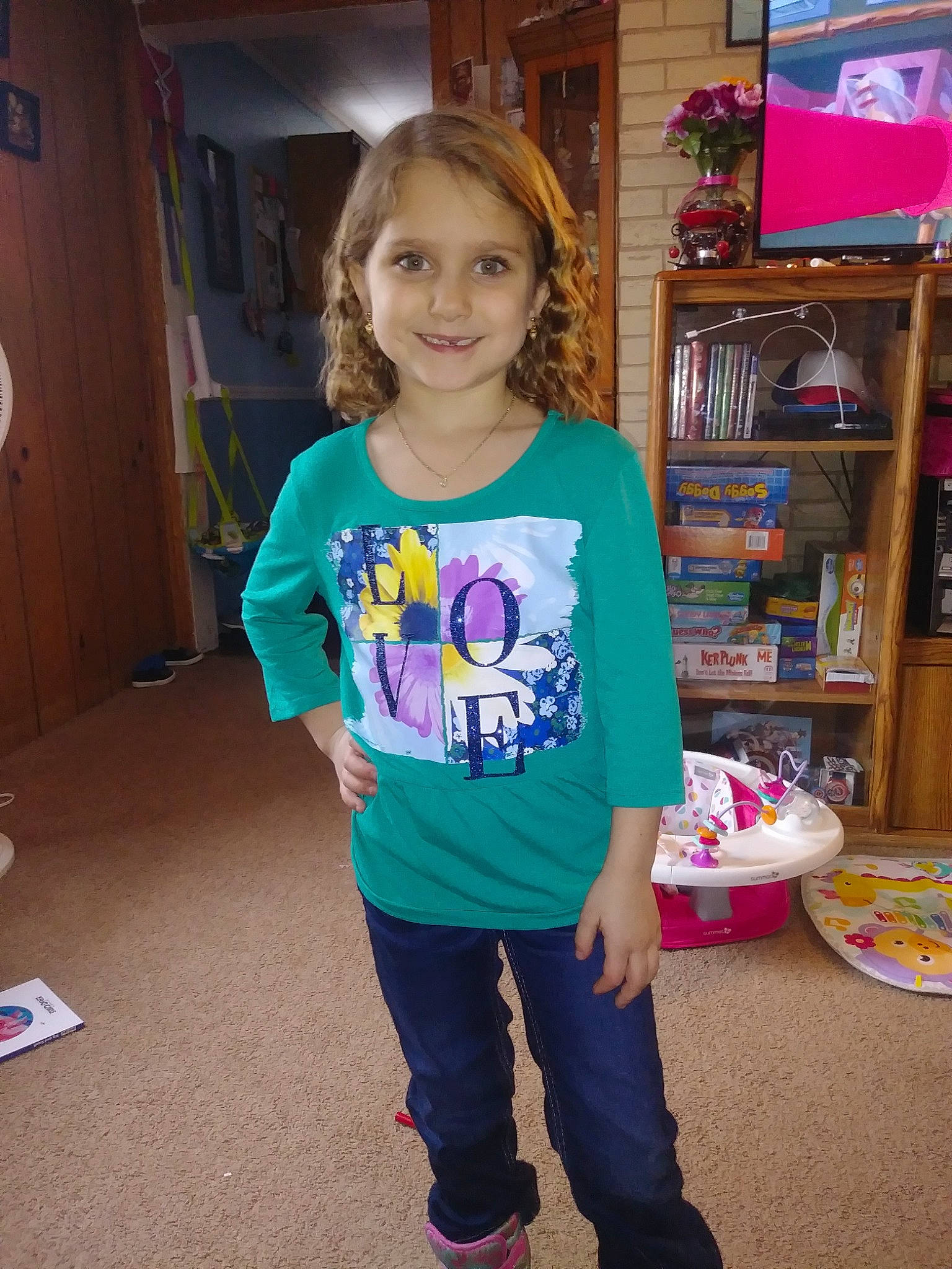 Skylar is registered to the contest to win money with this photo: blue, child, clothing, cool, day, fun, girl, jeans, joy, outerwear, person, pink, play, product, purple, shoulder, smile, standing, t_shirt, textile
