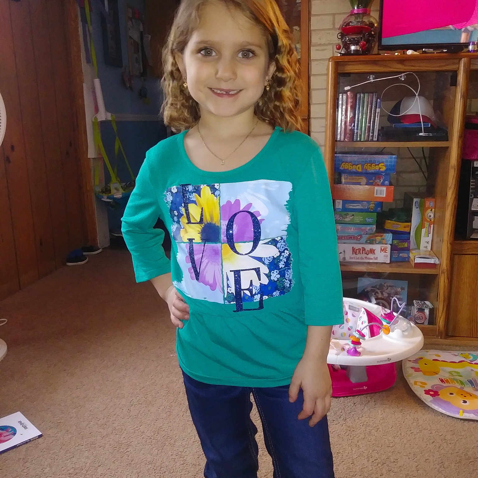 Skylar is registered to the contest to win money with this photo: blue, child, clothing, cool, day, fun, girl, jeans, joy, outerwear, person, pink, play, product, purple, shoulder, smile, standing, t_shirt, textile