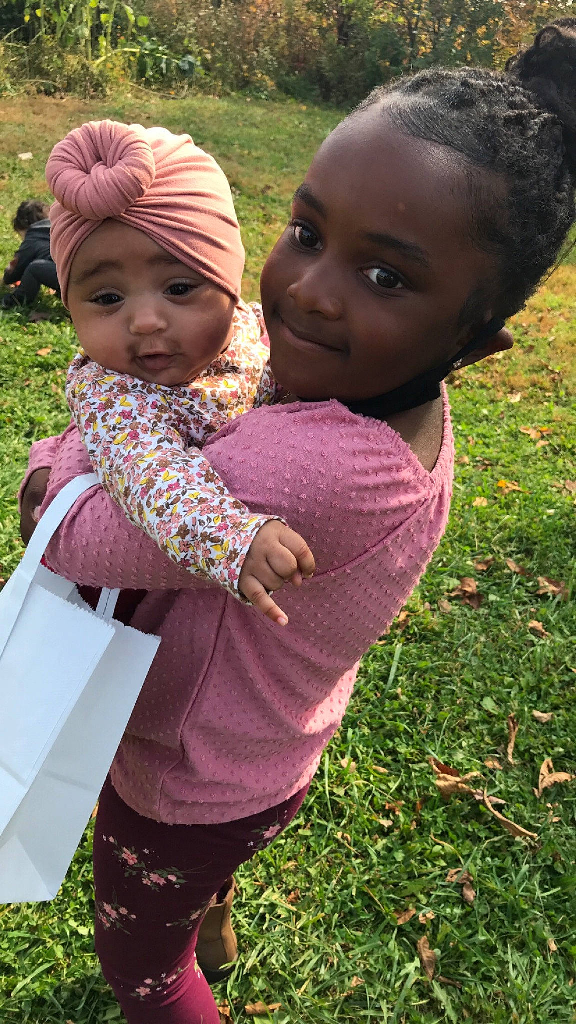 Faith joined the competition — help win amazing prizes! adaptation, child, grass, headwear, hug, joy, person, sibling, toddler