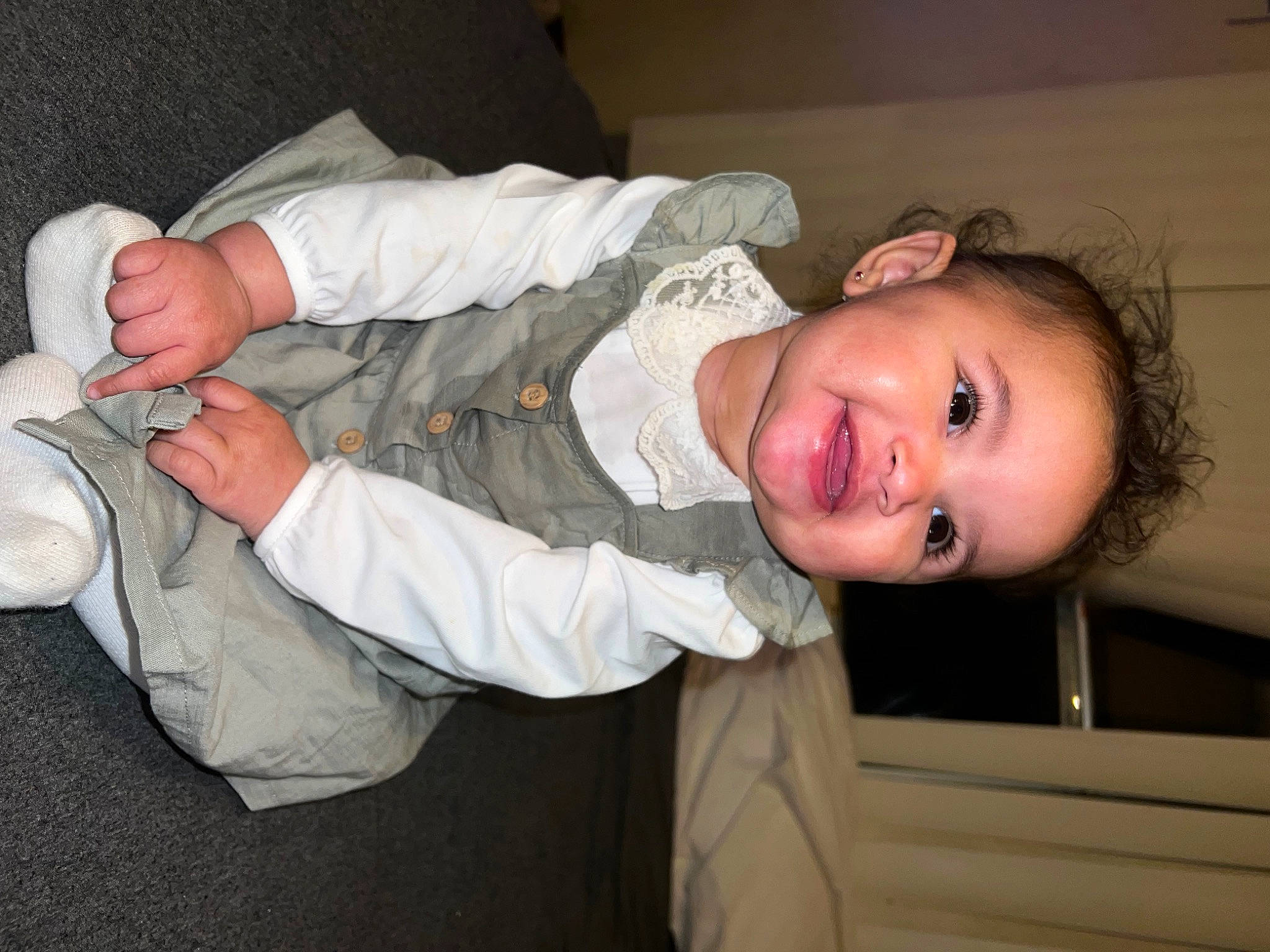 Sienna is registered to the contest to win money with this photo: baby, baby_toddler_clothing, cheek, child, comfort, eye, facial_expression, finger, fun, gesture, hand, happy, head, joy, mouth, nose, person, skin, sleeve, smile