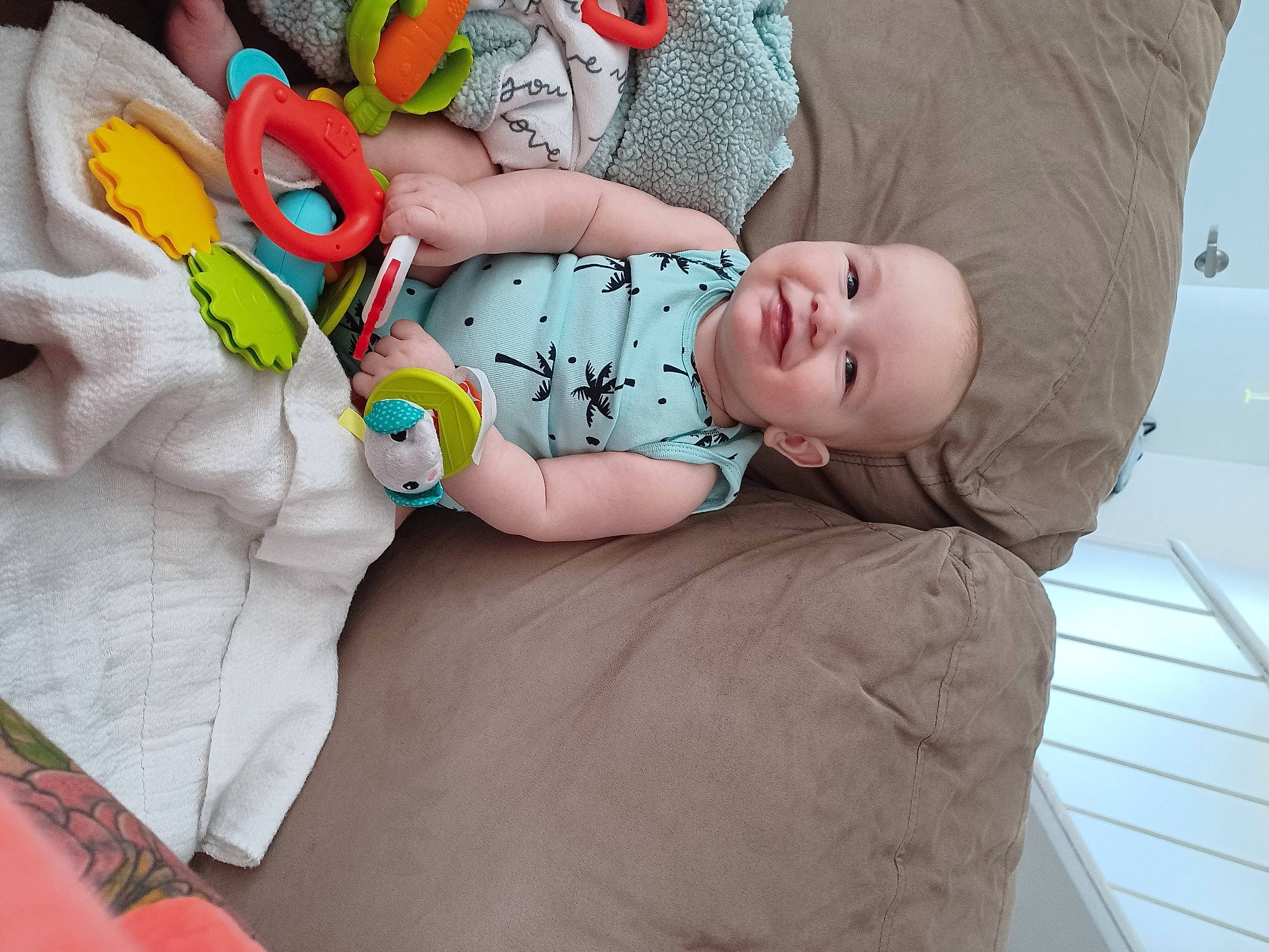 Reese joined the competition — help win amazing prizes! baby, baby_products, baby_sleeping, baby_toddler_clothing, bedding, bedtime, child, comfort, couch, happy, joy, linens, pattern, person, room, sitting, sleeve, sock, textile, thigh