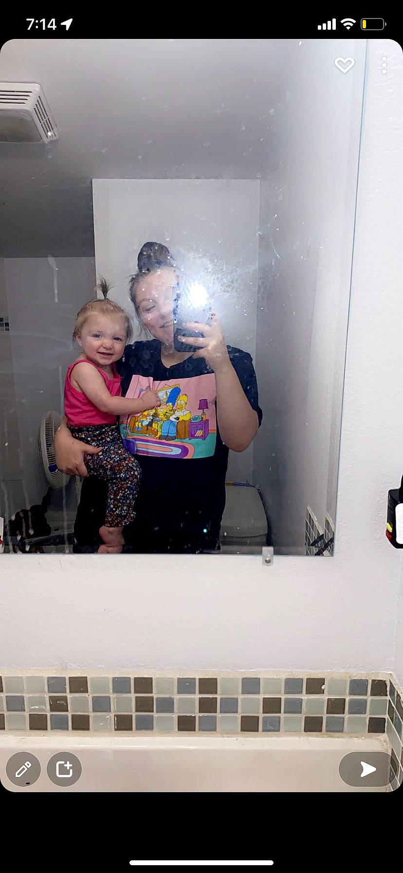 Rhaenyra is registered to the contest to win money with this photo: arm, art, bathroom, child, event, fashion_design, fun, gesture, mirror, person, room, shoulder, smile, t_shirt, toddler, visual_arts