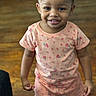 Brenlee is registered to the contest to win money with this photo: toddler, child, smiling, standing, indoors, braided_hair, pink_clothing, floral_pattern, shorts, shirt, wooden_floor, happy, cute, person, portrait, casual, young_child, playful, bright, innocent