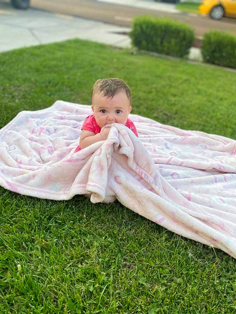 Mataya joined the competition — help win amazing prizes! baby, baby_products, baby_toddler_clothing, dress, event, grass, grass_family, grassland, happy, head, lawn, leisure, people_in_nature, person, petal, plant, recreation, sitting, tire, toddler