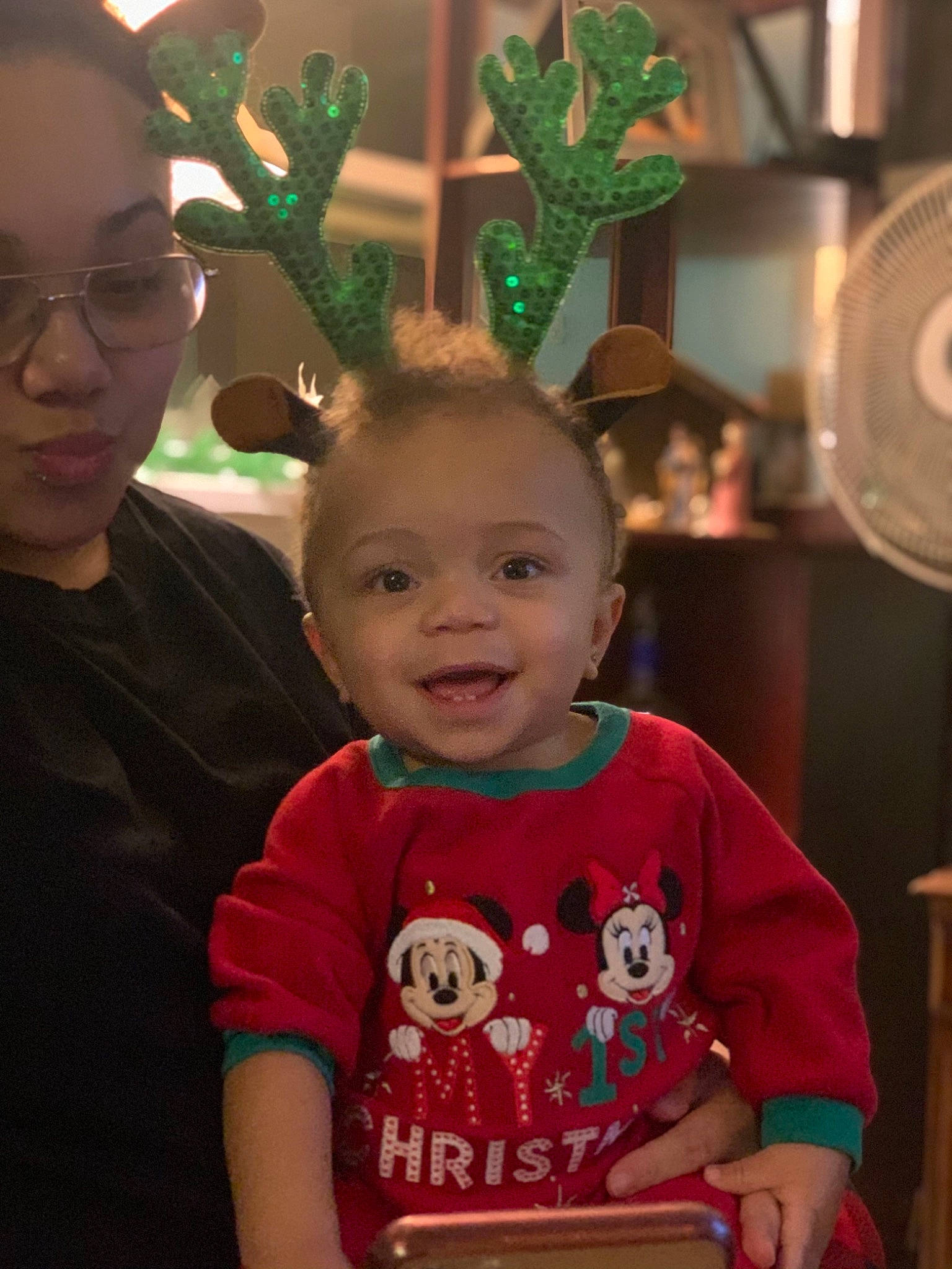 Amarion is registered to the contest to win money with this photo: antler, baby, baby_toddler_clothing, box, child, ear, fawn, glasses, head, holiday, iris, lamp, mechanical_fan, mouth, organ, person, stool, toddler