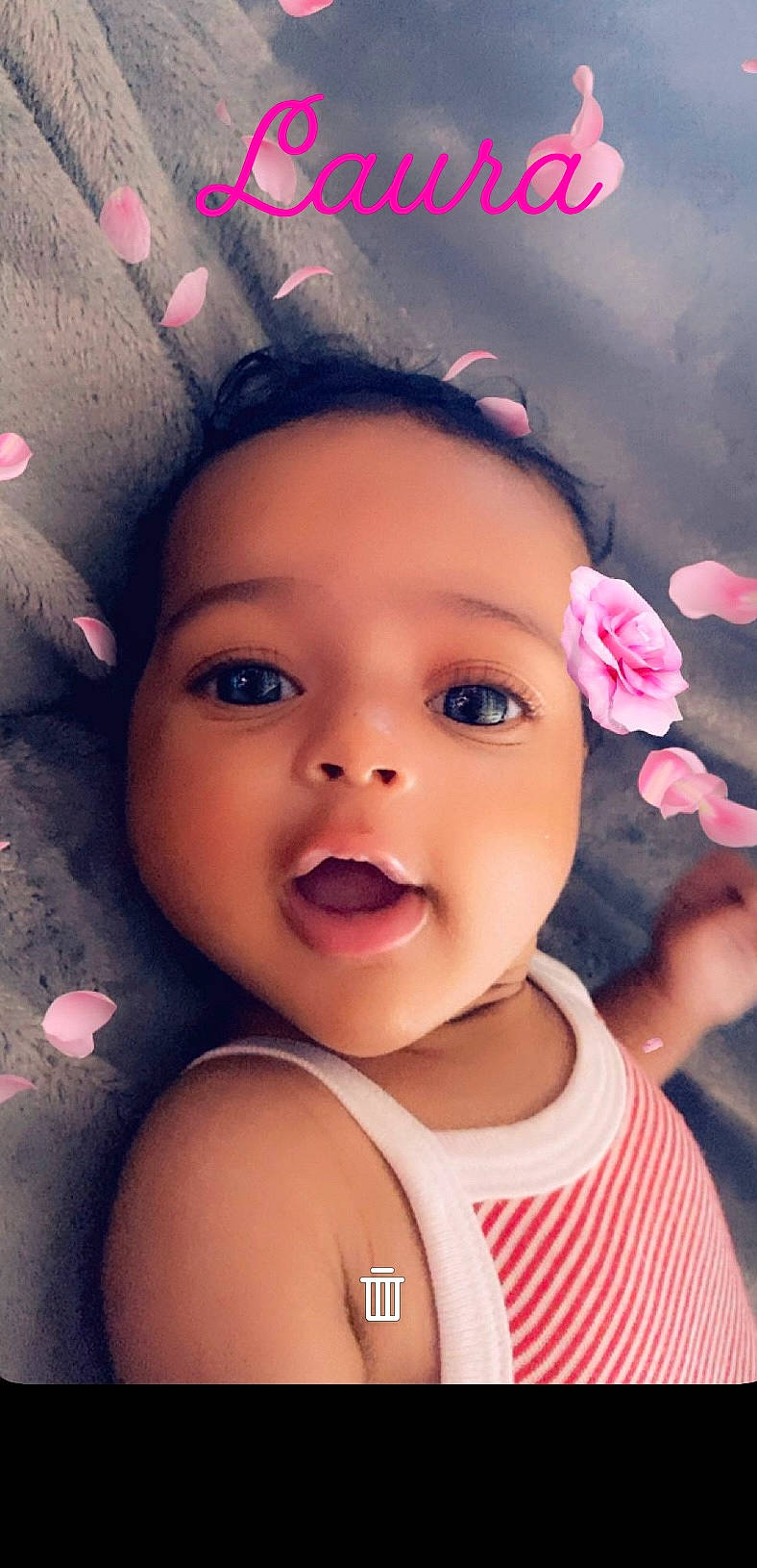 Laura participe au concours pour gagner de l'argent avec cette photo : baby, baby_toddler_clothing, black_hair, cheek, chin, cool, eye, eyebrow, eyelash, flash_photography, flower, happy, iris, lip, mouth, nose, person, pink, skin, smile