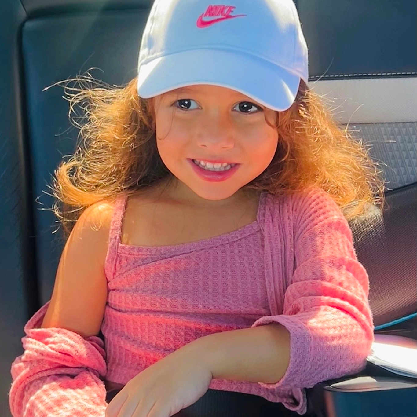 Samantha is registered to the contest to win money with this photo: baseballcap, blonde, cap, child, clothing, dimples, face, female, girl, hair, happy, hat, head, helmet, person, photography, portrait, sitting, sleeve, smile