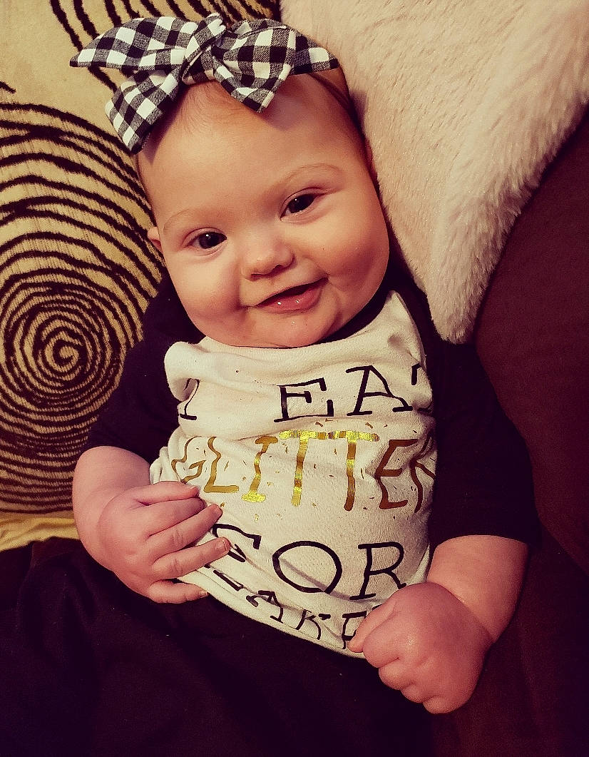 Sapphira is registered to the contest to win money with this photo: beanie, cap, cheek, child, cool, day, facial_expression, fun, girl, hair_accessory, happiness, headgear, headpiece, infant, joy, person, product, skin, smile, t_shirt