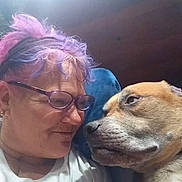 Bruno joined the competition — help win amazing prizes! person, dog, glasses, colored_hair, close_up, affection, indoor, casual_clothing, white_shirt, pet, companion, face, head, expression, love, bond, portrait, relaxed, animal, human