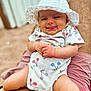 Livia participe au concours pour gagner de l'argent avec cette photo : baby, child, infant, hat, onesie, cherry_pattern, tongue_out, cute, smile, playful, skin, legs, arms, adult_lap, red_striped_shorts, outdoor, blurred_background, summer, sunhat, happy