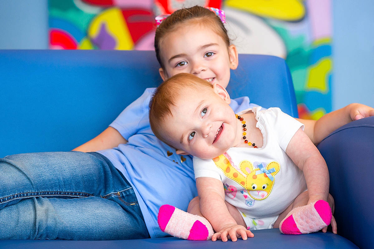 Kayla is registered to the contest to win money with this photo: baby, baby_toddler_clothing, child, comfort, event, face, flash_photography, fun, grass, happy, joy, leisure, person, play, playing_with_kids, portrait_photography, recreation, room, sitting, skin