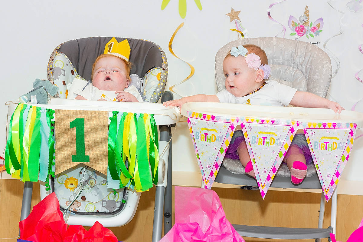 Kayla is registered to the contest to win money with this photo: baby, baby_products, baby_toddler_clothing, baby_toys, birthday_party, child, comfort, event, facial_expression, fun, happy, hat, pattern, person, pink, room, sharing, sitting, toddler, white