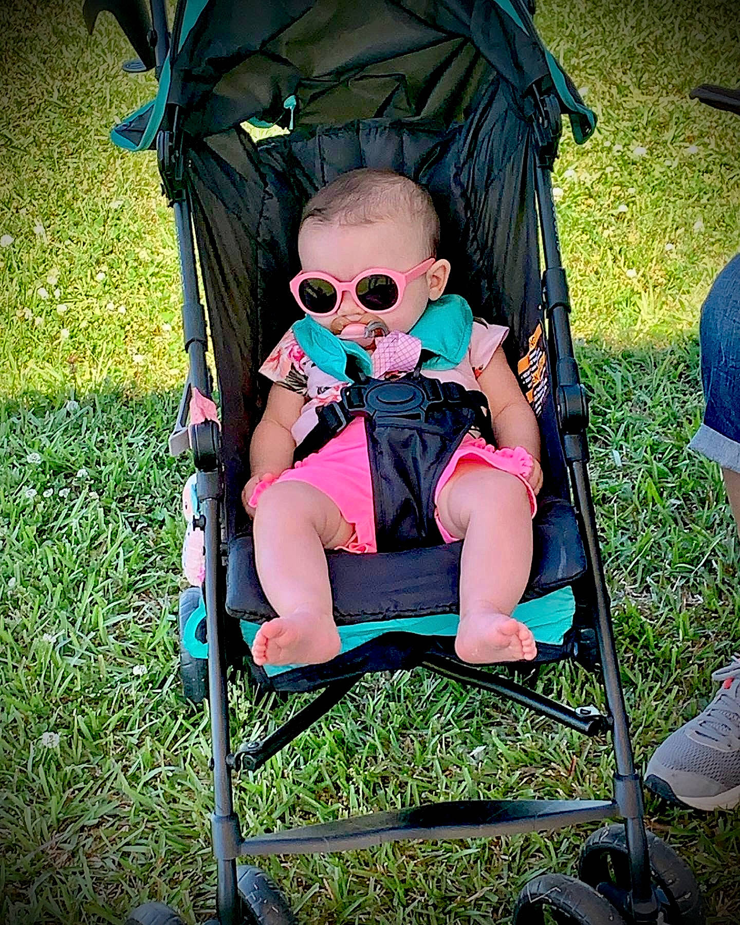Kristlyn joined the competition — help win amazing prizes! baby, baby_carriage, baby_toddler_clothing, blue, chair, comfort, eyewear, folding_chair, goggles, grass, green, leisure, person, photograph, plant, recreation, snapshot, sunglasses, tints_and_shades, toddler