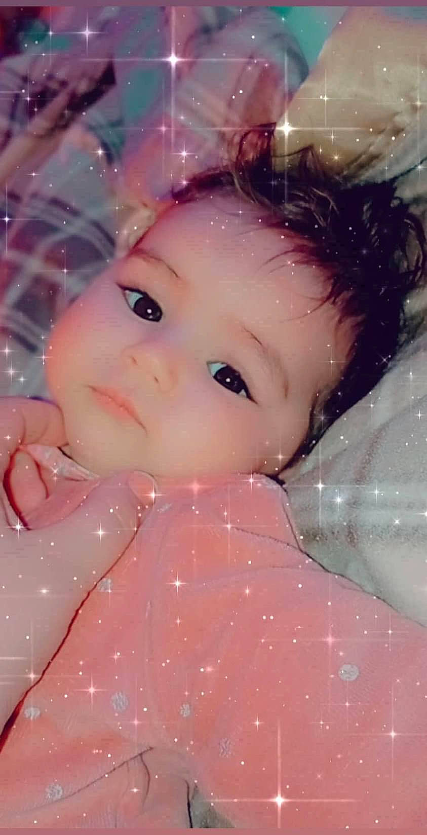 Inaya a rejoint le concours — aidez-le/la à gagner de superbes lots ! brown_hair, cheek, child, chin, close_up, doll, eyebrow, eyelash, forehead, fun, happy, iris, lip, nose, pattern, person, pink, skin, smile, textile