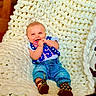 baby, infant, smile, happy, clothing, boots, denim, blanket, knitted, texture, indoor, portrait, person, cute, hand, chewing, photography, colorful, comfortable, sitting
