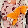 adorable, baby, blanket, child, comfort, cozy, cute, headband, heart_pattern, indoors, infant, newborn, pacifier, peaceful, pink_pajamas, plush_toy, resting, sleeping, soft, toddler