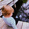 child, toddler, outdoor, dock, wood, water, pond, reflection, blond_hair, striped_shirt, sneakers, sitting, back_view, profile, nature, summer, retro_filter, photography, daylight, exploration