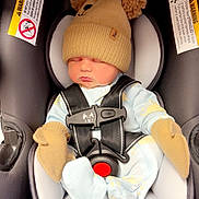 Hayden joined the competition — help win amazing prizes! baby, infant, newborn, car_seat, hat, pompom_hat, mittens, harness, buckle, sleeping, cute, cozy, pajamas, seat_padding, safety_label, portrait, soft_fabric, pink_cheeks, infant_clothing, car_seat_insert