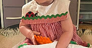 Kennidi joined the competition — help win amazing prizes! baby, child, indoor, dress, red, white, toy, orange, blanket, furniture, drawer, sitting, cute, person, smile, short_hair, floor, room, home, infant