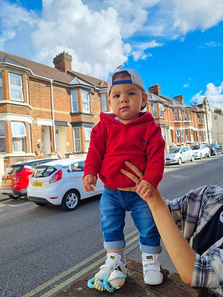 Mathias joined the competition — help win amazing prizes! asphalt, blue, building, car, child, cloud, electric_blue, fun, happy, headwear, jeans, leisure, person, recreation, road, sky, street_fashion, toddler, travel, vehicle