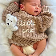 Koray is registered to the contest to win money with this photo: newborn, baby, sleeping, knitted_sweater, teddy_bear, soft_blanket, infant, cute, peaceful, cozy, child, portrait, closeup, tiny_feet, relaxing, indoors, cuddly, warm, adorable, resting