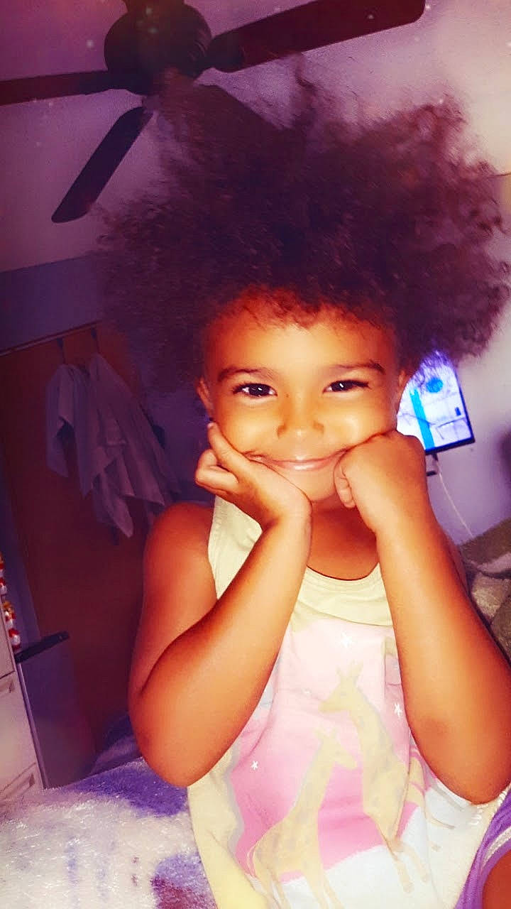 Colzy is registered to the contest to win money with this photo: afro, arm, black_hair, chin, cool, eyebrow, eyelash, flash_photography, fun, gesture, hairstyle, happy, jheri_curl, joy, lip, magenta, person, pink, purple, skin