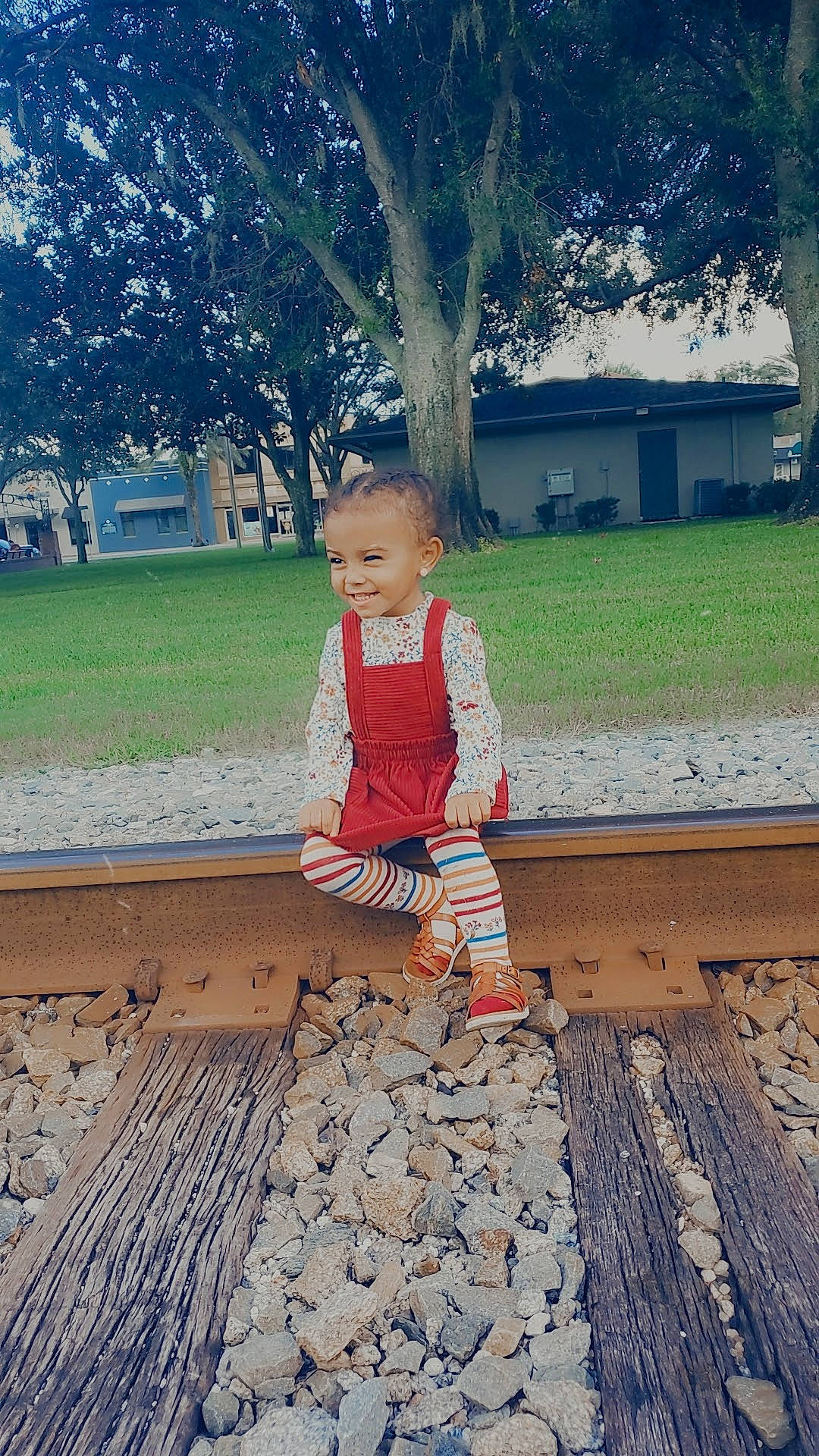 Jeanette is registered to the contest to win money with this photo: child, flooring, fun, grass, happy, human_leg, joy, landscape, leisure, morning, pattern, people_in_nature, person, plant, shadow, sitting, soil, spring, tints_and_shades, toddler