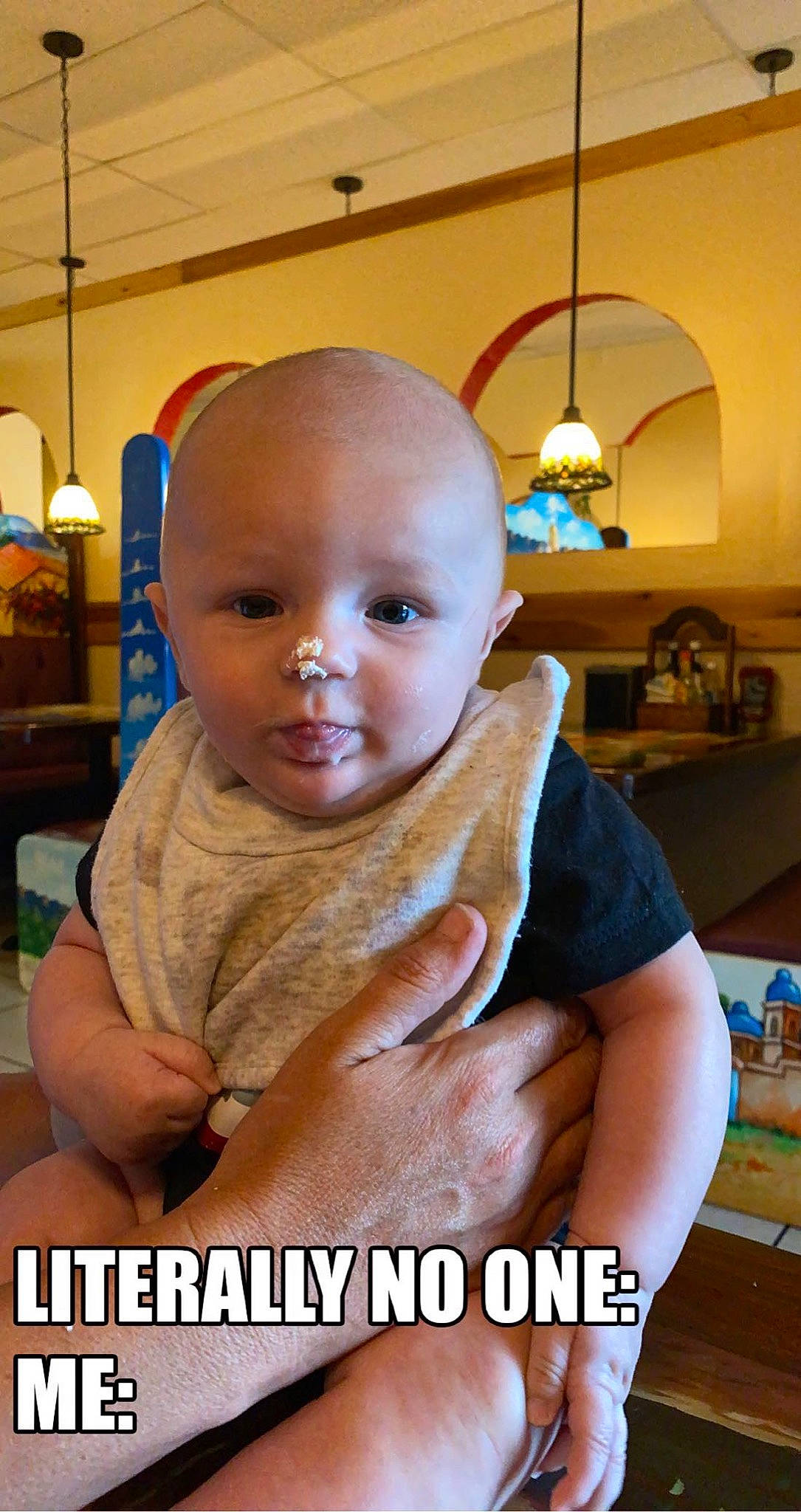 Creed is registered to the contest to win money with this photo: baby, baby_toddler_clothing, chair, cheek, child, flooring, fun, gesture, happy, houseplant, lamp, leisure, person, photo_caption, portrait_photography, room, sitting, sleeve, smile, toddler